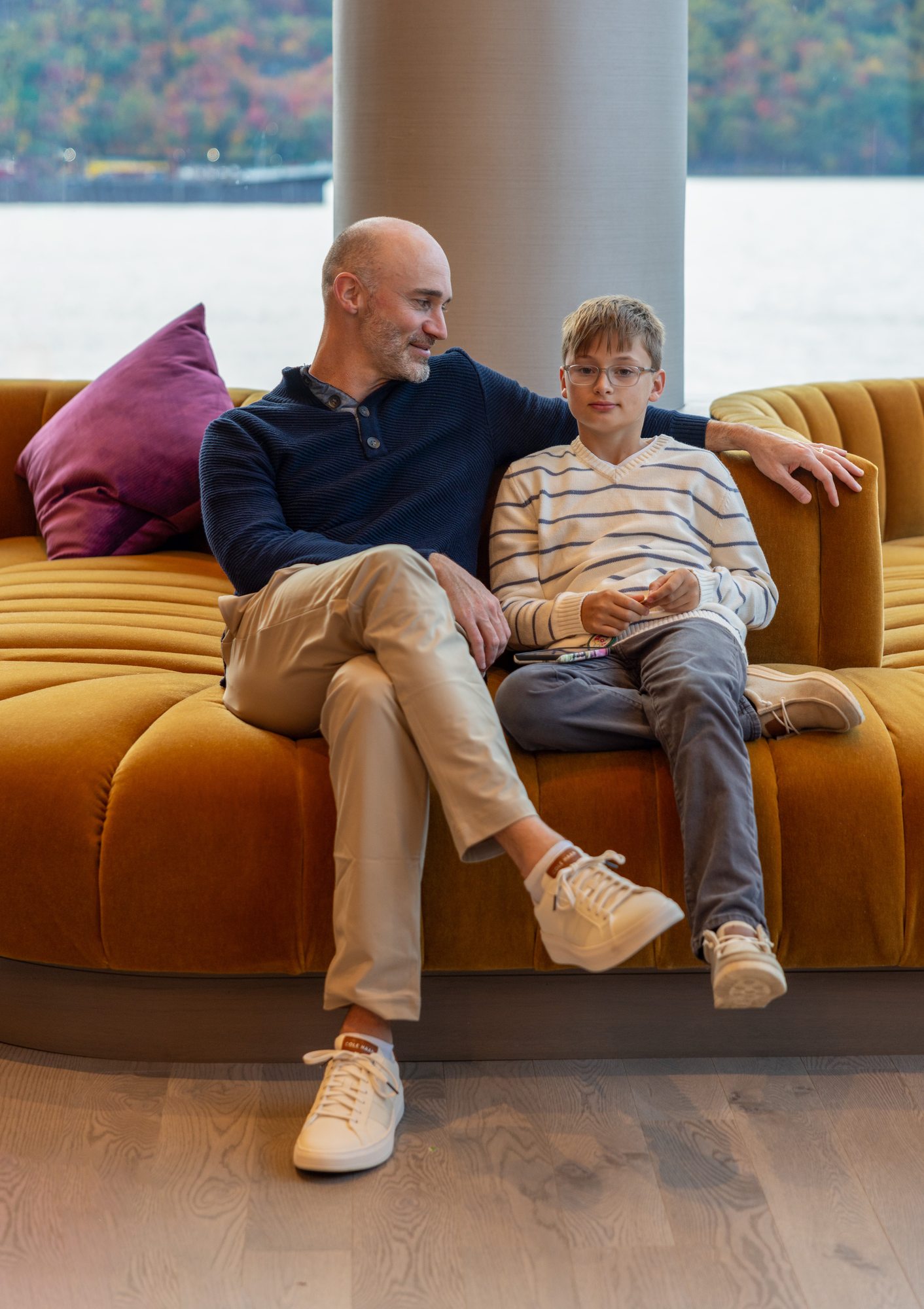 Father and son in the waterfront lounge