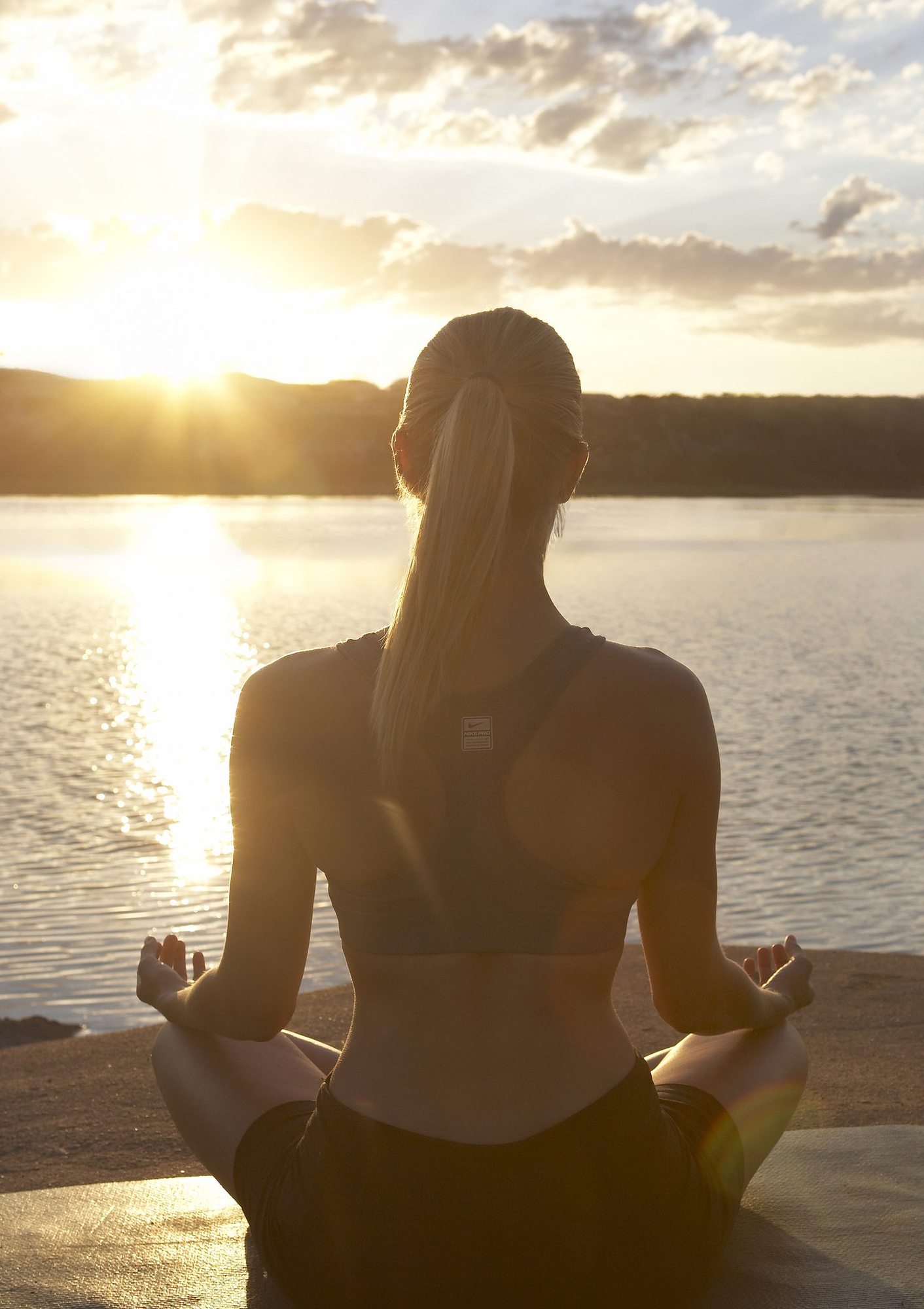 Sunrise yoga by the water